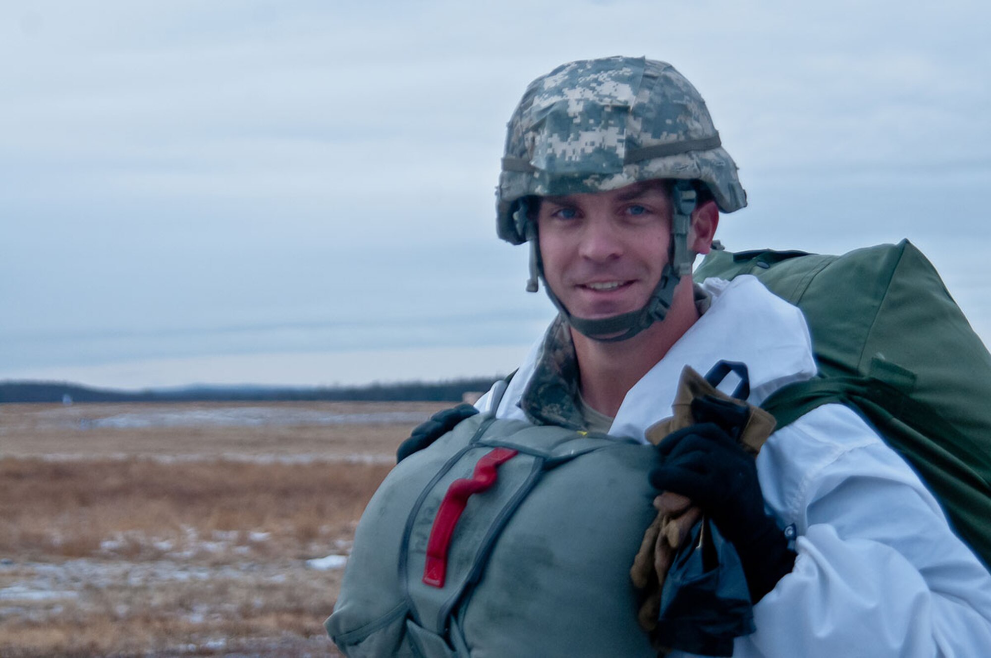 First Sgt. Herbert Gill, a jumpmaster and company first sergeant for U.S. Army Alaska’s Headquarters Company, 4th Infantry Brigade Combat Team (Airborne), 25th Infantry Division, walks off Malemute Drop Zone after performing a proficiency jump from a CH-47 Chinook helicopter flown by B Company, 1st Battalion, 52nd Aviation Regiment “Sugar Bears,” on Joint Base Elmendorf-Richardson March 6. This was Gill’s 65th parachute jump, and the one which earned him the coveted master parachutist badge – the highest award a jumpmaster can receive. (U.S. Army photo/Sgt. Eric-James Estrada)