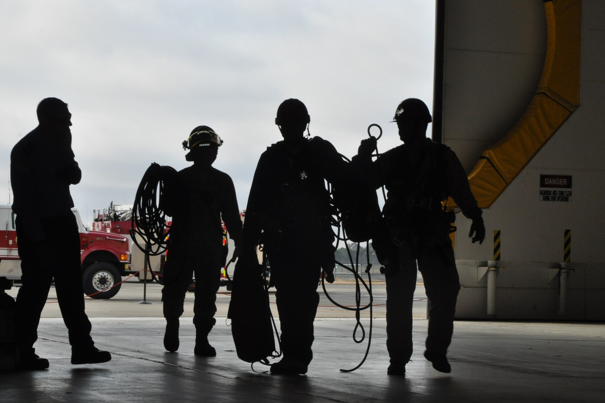 Members of the 4th Fighter Wing Civil Engineer Fire Department respond to rescue an injured victim--a 165-pound rubber dummy--from inside a mock KC-135R wing fuel tank during an annual confined space rescue exercise held here, May 11, 2015. (U.S. Air Force photo/Master Sgt. Wendy Lopedote)

