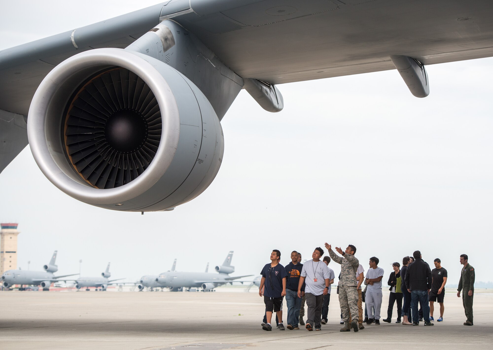 Staff Sgt. Garrett Garza, 60th Aircraft Maintenance Squadron crew chief, describes the C-5M Super Galaxy to local high school students and recent Air Force recruits March 9 during the Golden Bear Outreach and Recruiting event at Travis Air Force Base, Calif. (U.S. Air Force photo by Ken Wright)