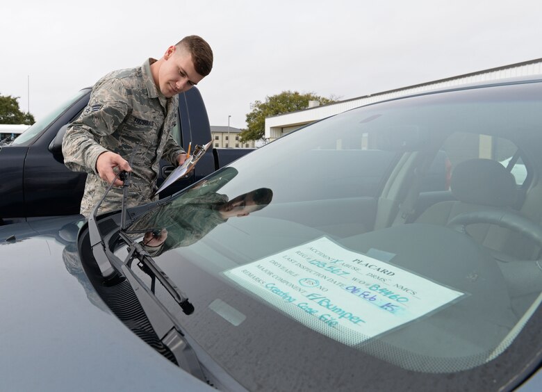 Senior Airman Ryan Fitzgerald, 81st Logistics Readiness Squadron vehicle management and analysis technician, inspects a vehicle March 11, 2015, Keesler Air Force Base, Miss. The more than 40 member maintenance flight repair and oversee more than 420 government vehicles that belong to Keesler. (U.S. Air Force photo by Senior Airman Holly Mansfield)