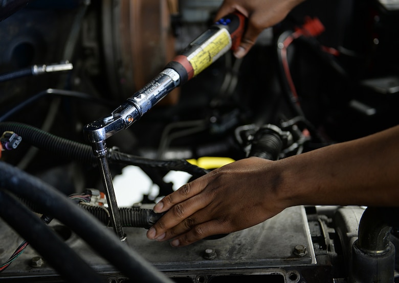 Senior Airman Kenneth Carter, 81st Logistics Readiness Squadron vehicle maintenance technician, repairs a security forces truck March 11, 2015, Keesler Air Force Base, Miss. The more than 40 member vehicle maintenance flight repair and oversee more than 420 government vehicles that belong to Keesler. (U.S. Air Force photo by Senior Airman Holly Mansfield)