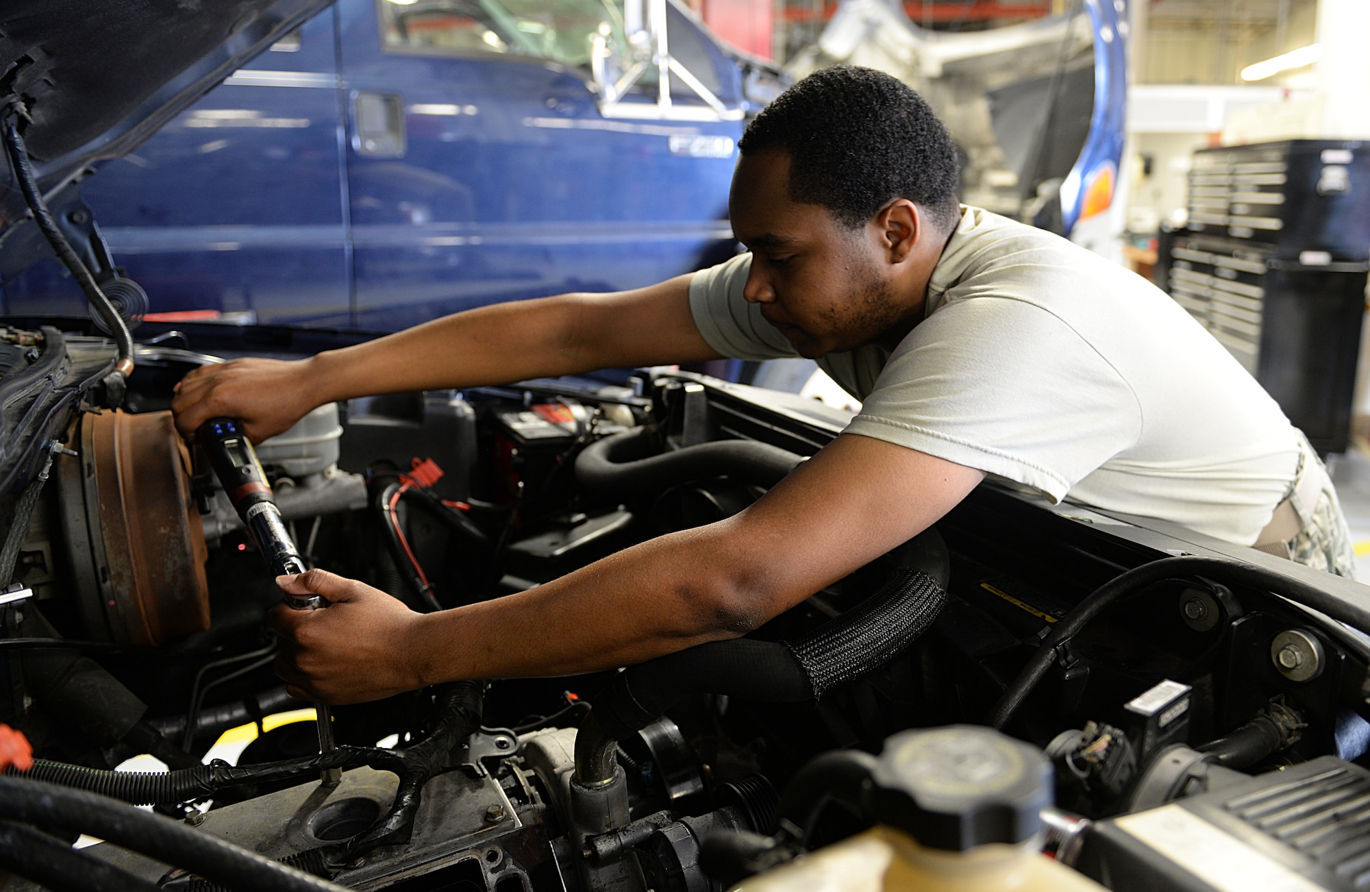 Senior Airman Kenneth Carter, 81st Logistics Readiness Squadron vehicle maintenance technician, repairs a security forces truck March 11, 2015, Keesler Air Force Base, Miss. The more than 40 member vehicle maintenance flight repair and oversee more than 420 government vehicles that belong to Keesler. (U.S. Air Force photo by Senior Airman Holly Mansfield)