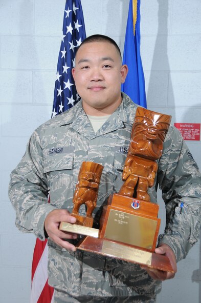 U.S. Air Force Senior Airman Ken Hayashi, Hawaii Air National Guard 201st Intelligence Squadron, wins the Airman of the Year Award for the Traditional category during the 2015 Launa 'Ole Awards ceremony at Joint Base Pearl Harbor-Hickam, Hawaii on March 8, 2015. Airman Hayashi aided the Joint Special Operations Task Force, Combat Ops Team by flying 92 combat missions totaling 452 hours. He also organized support for the Lanakila Meals on Wheels Program, delivering means to Hawaii’s elderly on Thanksgiving Day. (U.S. Air National Guard photo by Airman 1st Class Robert Cabuco)


