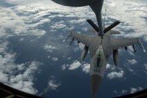 A U.S. Air Force KC-135 Stratotanker from the 909th Aerial Refueling Squadron, Kadena Air Base, Japan, refuels a F-16 Fighting Falcon from the 14th Fighter Squadron, Misawa Air Base, Japan, during an exercise sortie flown at Cope North 15, Feb. 20, 2015, off the coast of Guam. Through training exercises such as Exercise Cope North 15, the U.S., Japan and Australia air forces develop combat capabilities, enhancing air superiority, electronic warfare, air interdiction, tactical airlift and aerial refueling. (U.S. Air Force photo by Tech. Sgt. Jason Robertson/Released)