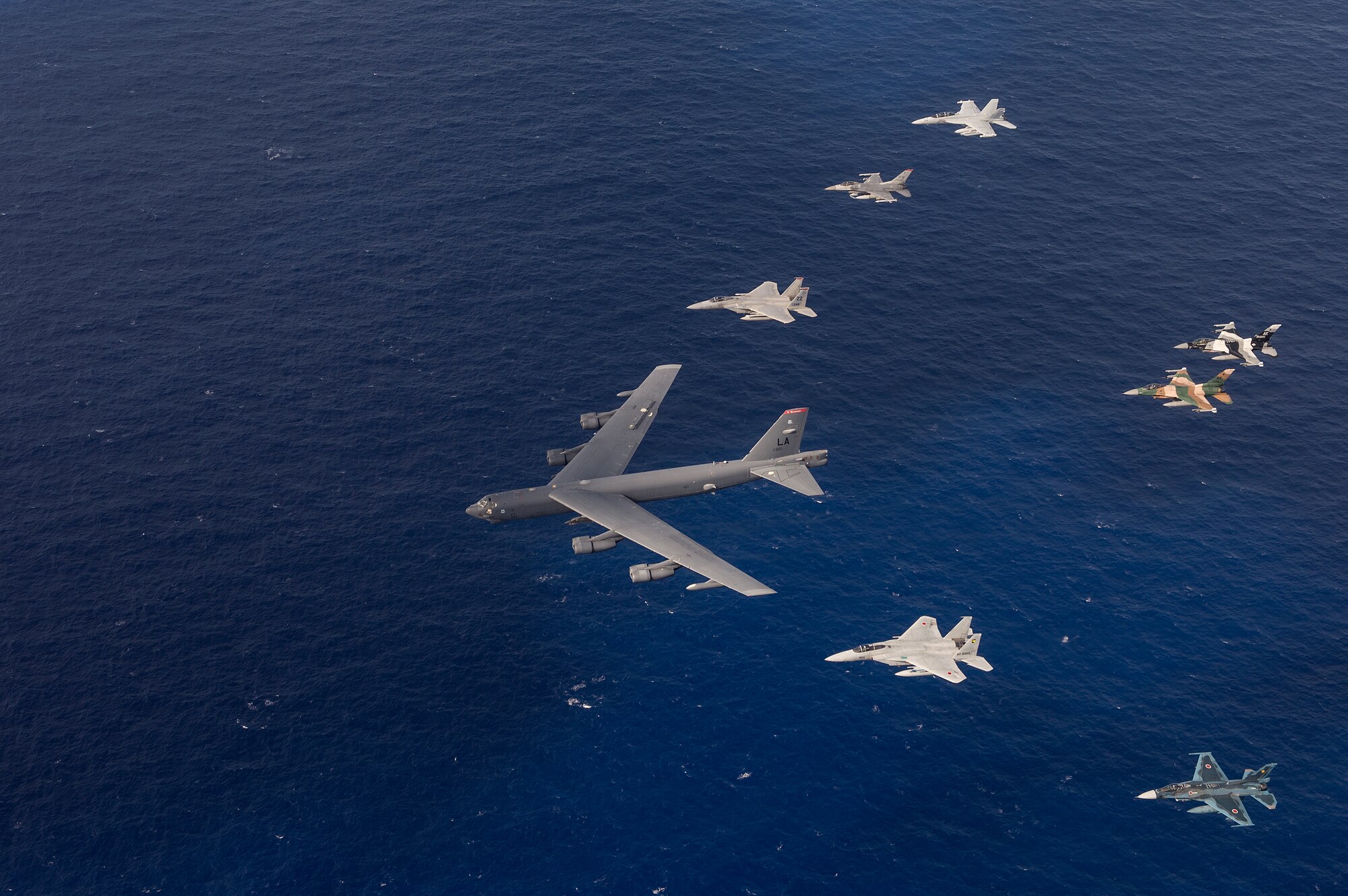U.S. Air Force and Japan Air Self-Defense Force aircraft, fly in formation during a photo exercise at Cope North 15, Feb. 17, 2015, over Guam. Through training exercises such as Exercise Cope North 15, the U.S., Japan and Australia air forces develop combat capabilities, enhancing air superiority, electronic warfare, air interdiction, tactical airlift and aerial refueling. (U.S. Air Force photo by Tech. Sgt. Jason Robertson/Released)