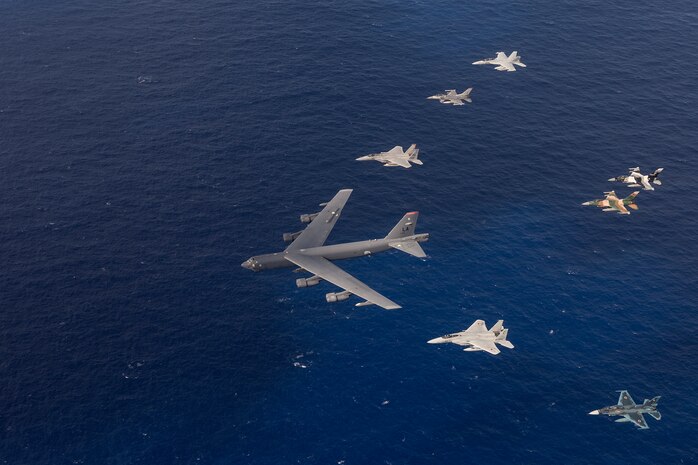 U.S. Air Force and Japan Air Self-Defense Force aircraft, fly in formation during a photo exercise at Cope North 15, Feb. 17, 2015, over Guam. Through training exercises such as Exercise Cope North 15, the U.S., Japan and Australia air forces develop combat capabilities, enhancing air superiority, electronic warfare, air interdiction, tactical airlift and aerial refueling. (U.S. Air Force photo by Tech. Sgt. Jason Robertson/Released)