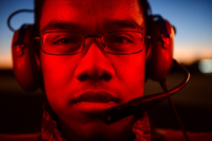 U.S. Air Force Airman 1st Class Andrew-John Thong, 437th Aircraft Maintenance Squadron dedicated crew chief, marshals a C-17 Globemaster III at Charleston Air Force Base - Air Base, Jan. 27, 2015. The 437th Aircraft Maintenance Squadron is composed of nearly 1,000 combat-ready maintainers and support personnel, comprised of Active Duty, Civilian, and Air Reserve Technician components. They inspect, service, and maintain the assigned C-17 aircraft at Joint Base Charleston. These maintainers enable aircraft to perform assigned global airlift missions ranging from combat support operations and humanitarian relief to aeromedical evacuations. (U.S. Air Force photo by Senior Airman Daniel Hughes/Not Reviewed)