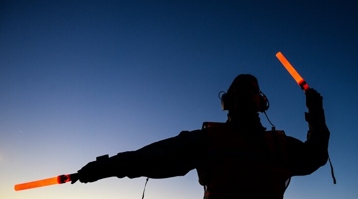 U.S. Air Force Airman 1st Class Andrew-John Thong, 437th Aircraft Maintenance Squadron dedicated crew chief, marshals a C-17 Globemaster III at Charleston Air Force Base - Air Base, Jan. 27, 2015. The 437th Aircraft Maintenance Squadron is composed of nearly 1,000 combat-ready maintainers and support personnel, comprised of Active Duty, Civilian, and Air Reserve Technician components. They inspect, service, and maintain the assigned C-17 aircraft at Joint Base Charleston. These maintainers enable aircraft to perform assigned global airlift missions ranging from combat support operations and humanitarian relief to aeromedical evacuations. (U.S. Air Force photo by Senior Airman Daniel Hughes/Not Reviewed)