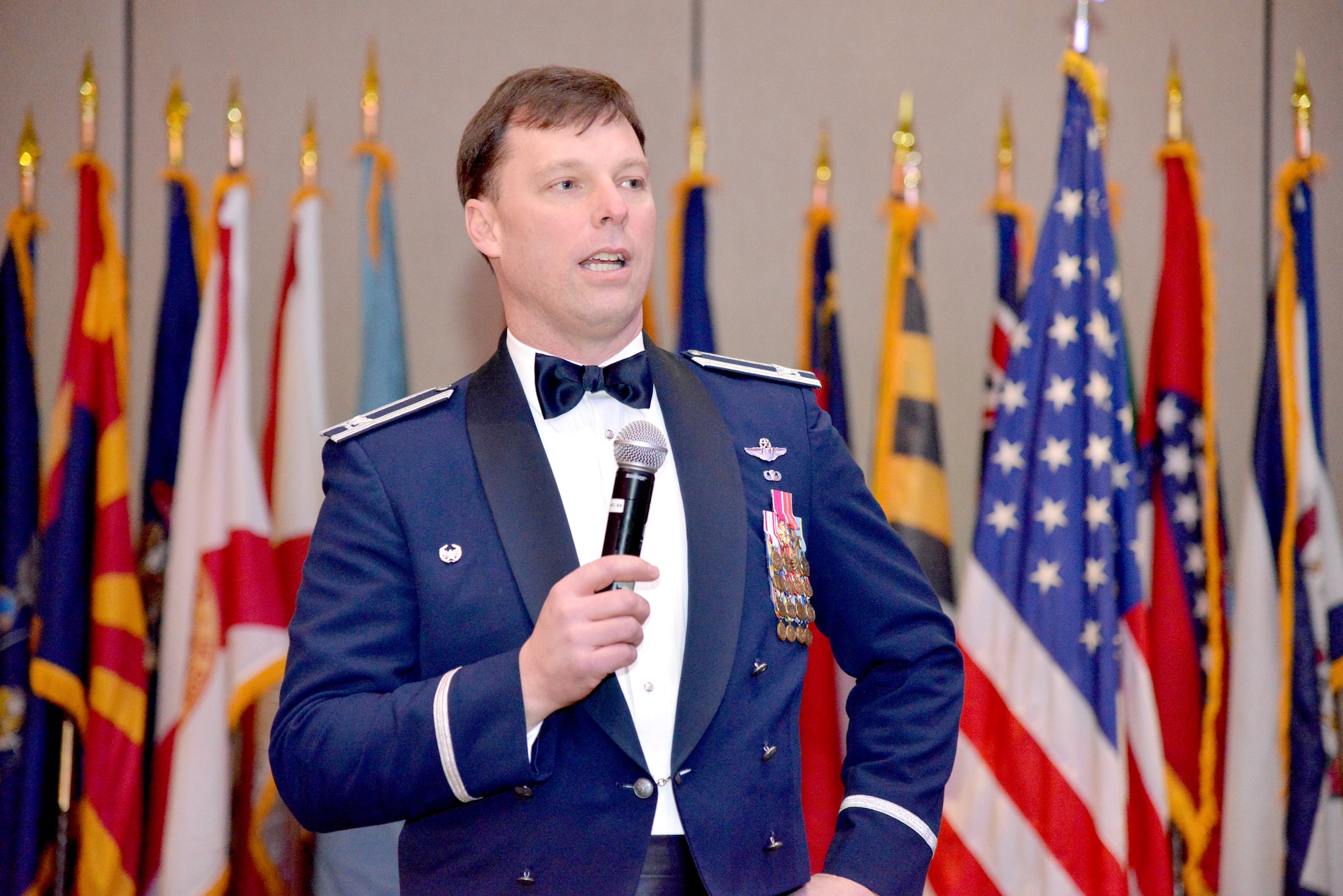 Col. Dagvin Anderson, 58th Special Operations Wing commander, congratulates annual award winners at a ceremony Feb. 21. (Photo by Jamie Burnett)