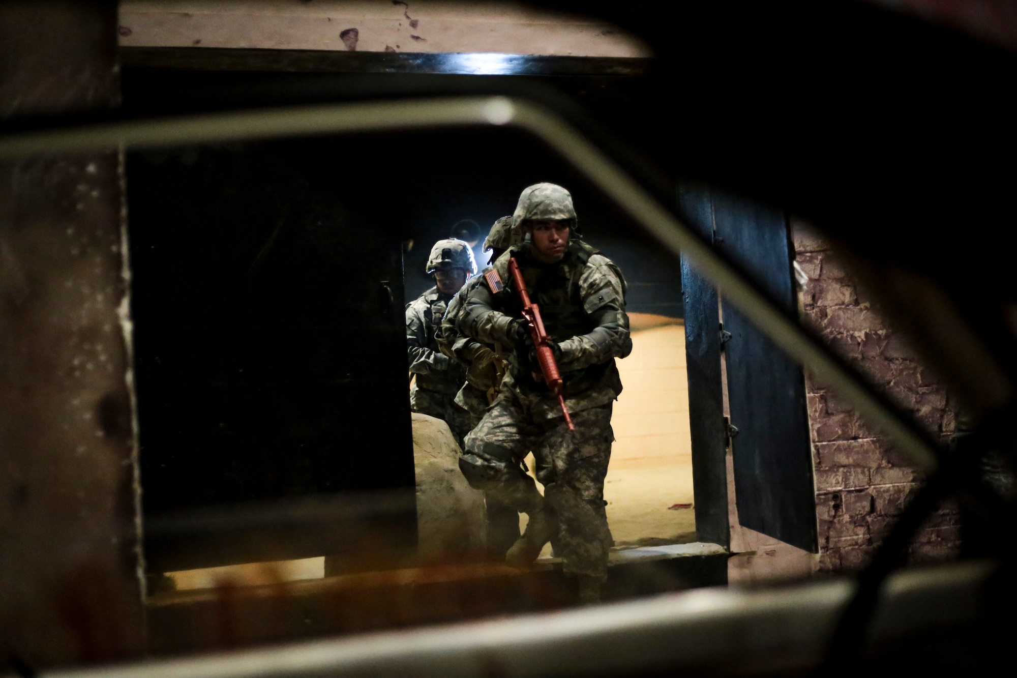 U.S. Army Soldiers participate in a Modern Army Combatives Program (MACP) training scenario at the New Jersey National Guard Training and Training Technology Battle Lab at Joint Base McGuire-Dix-Lakehurst, N.J., March 11, 2015. The Battle Lab features numerous combat simulators, as well as an indoor urban area for ground combat training. (U.S. Air National Guard photo by Tech. Sgt. Matt Hecht/Released)