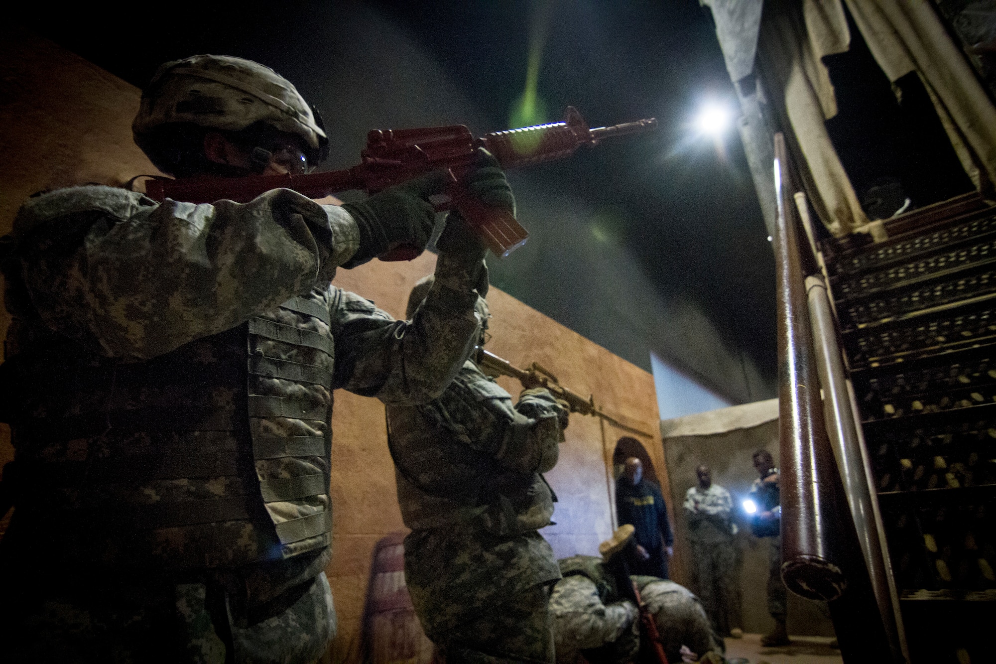 U.S. Army Soldiers participate in a Modern Army Combatives Program (MACP) training scenario at the New Jersey National Guard Training and Training Technology Battle Lab at Joint Base McGuire-Dix-Lakehurst, N.J., March 11, 2015. The Battle Lab features numerous combat simulators, as well as an indoor urban area for ground combat training. (U.S. Air National Guard photo by Tech. Sgt. Matt Hecht/Released)