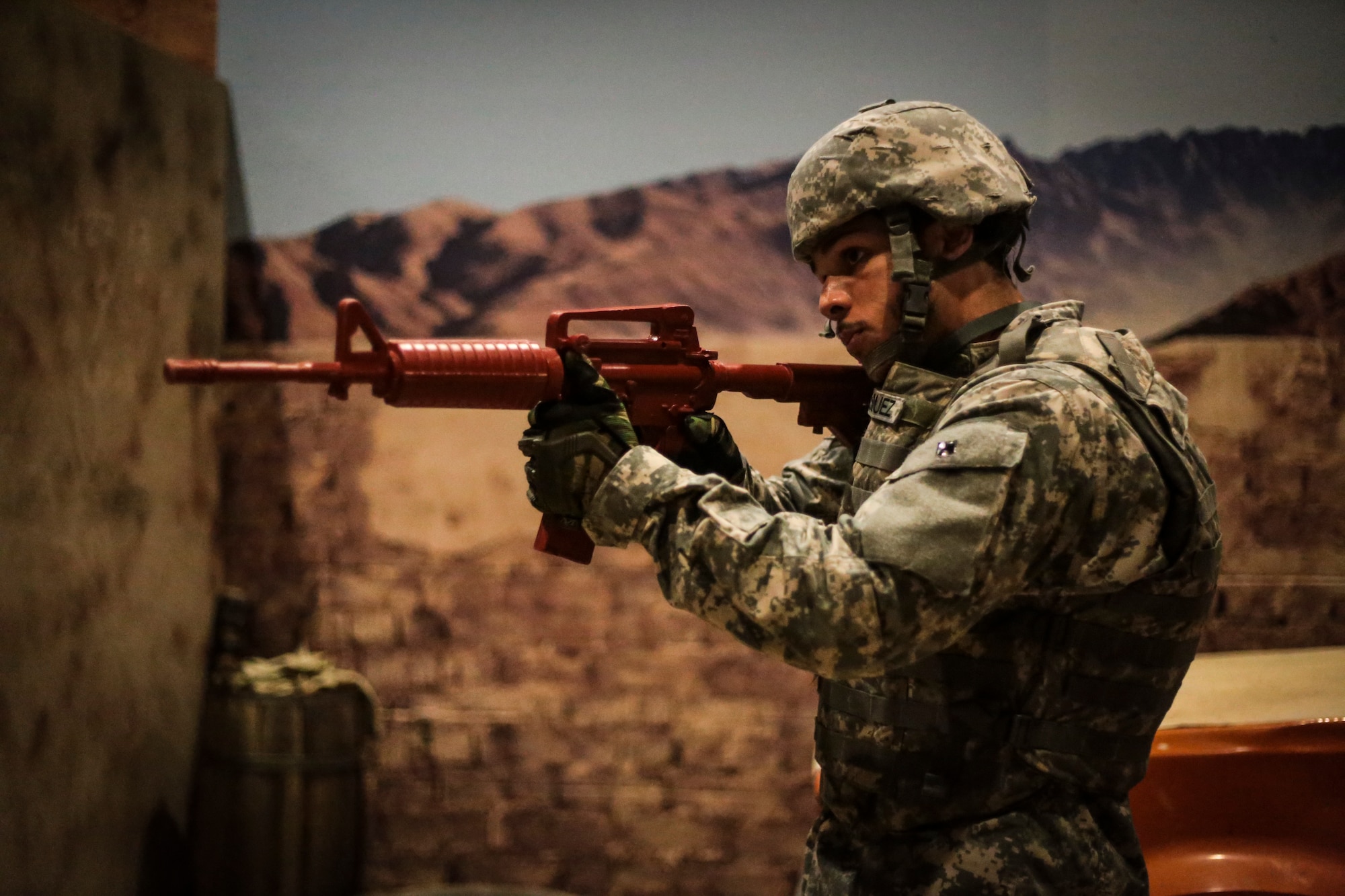 A U.S. Army soldier does rear security during a Modern Army Combatives Program (MACP) training scenario at the New Jersey National Guard Training and Training Technology Battle Lab at Joint Base McGuire-Dix-Lakehurst, N.J., March 11, 2015. The Battle Lab features numerous combat simulators, as well as an indoor urban area for ground combat training. (U.S. Air National Guard photo by Tech. Sgt. Matt Hecht/Released)