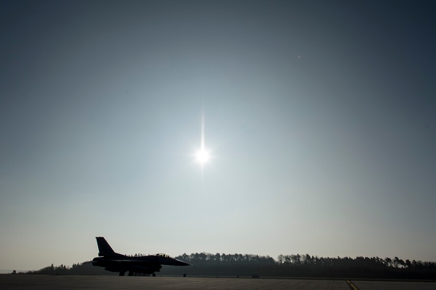 A U.S. Air Force F-16 Fighting Falcon fighter aircraft assigned to the 480th Fighter Squadron taxies on the runway at Spangdahlem Air Base, Germany, March 13, 2015. The aircraft will participate in Dacian Warhawk 2015, a bilateral flying training deployment between the U.S. and Romanian air forces at Campia Turzii, Romania, March 16-27, 2015. The exercise aims to strengthen the NATO partners’ interoperability and their readiness to conduct combined air operations. (U.S. Air Force photo by Senior Airman Rusty Frank/Released)