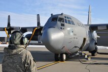 YOUNGSTOWN AIR RESERVE STATION, Ohio –Air Force Reserve Master Sgt. Rachel Fidram, a crew chief assigned to the 910th Aircraft Maintenance Squadron performs pre-flight checks on a C-130H Hercules aircraft, assigned to the 910th Airlift Wing, while it sits on the flightline here prior to an airdrop training mission, March 8, 2015. Fidram, a dedicated crew chief directs and performs maintenance operations on her assigned aircraft. The wing uses their C-130 aircraft during combat operations, including low-level infiltration flights, to deliver personnel and materials by airdrop or air-land methods as part of their wartime tasking, to conduct humanitarian relief efforts and for the wing’s mission as the Department of Defense’s only large-area fixed-wing aerial spray capability. U.S. Air Force photo by Master Sgt. Bob Barko Jr.