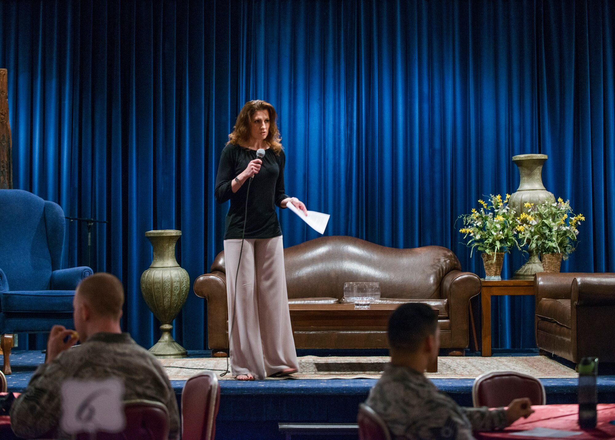 Master Sgt. Janee Walker, 39th Force Support Squadron Airman and Family Readiness Center superintendent, briefs the audience at a Woman’s History Month Storytellers event March 9, 2015, at Incirlik Air Base, Turkey. Walker is a member of the WHM committee and was the host for the night’s events. (U.S. Air Force photo by Airman Cory W. Bush/Released)