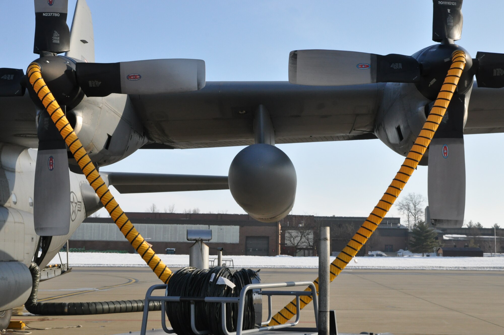 YOUNGSTOWN AIR RESERVE STATION, Ohio – A propeller heating system is attached to the engines of an Air Force Reserve 910th Airlift Wing  C-130H Hercules aircraft while it sits on the flightline here prior to an airdrop training mission, March 8, 2015. The heating system, operated and maintained by a joint effort of the 910th Aircraft Maintenance Squadron and the 910th Maintenance Squadron, are used to de-ice the aircraft’s propeller assemblies prior to operations in freezing weather conditions.  The wing uses their C-130 aircraft during combat operations, including low-level infiltration flights, to deliver personnel and materials by airdrop or air-land methods as part of their wartime tasking, to conduct humanitarian relief efforts and for the wing’s mission as the Department of Defense’s only large-area fixed-wing aerial spray capability. U.S. Air Force photo by Master Sgt. Bob Barko Jr.