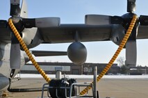 YOUNGSTOWN AIR RESERVE STATION, Ohio – A propeller heating system is attached to the engines of an Air Force Reserve 910th Airlift Wing  C-130H Hercules aircraft while it sits on the flightline here prior to an airdrop training mission, March 8, 2015. The heating system, operated and maintained by a joint effort of the 910th Aircraft Maintenance Squadron and the 910th Maintenance Squadron, are used to de-ice the aircraft’s propeller assemblies prior to operations in freezing weather conditions.  The wing uses their C-130 aircraft during combat operations, including low-level infiltration flights, to deliver personnel and materials by airdrop or air-land methods as part of their wartime tasking, to conduct humanitarian relief efforts and for the wing’s mission as the Department of Defense’s only large-area fixed-wing aerial spray capability. U.S. Air Force photo by Master Sgt. Bob Barko Jr.