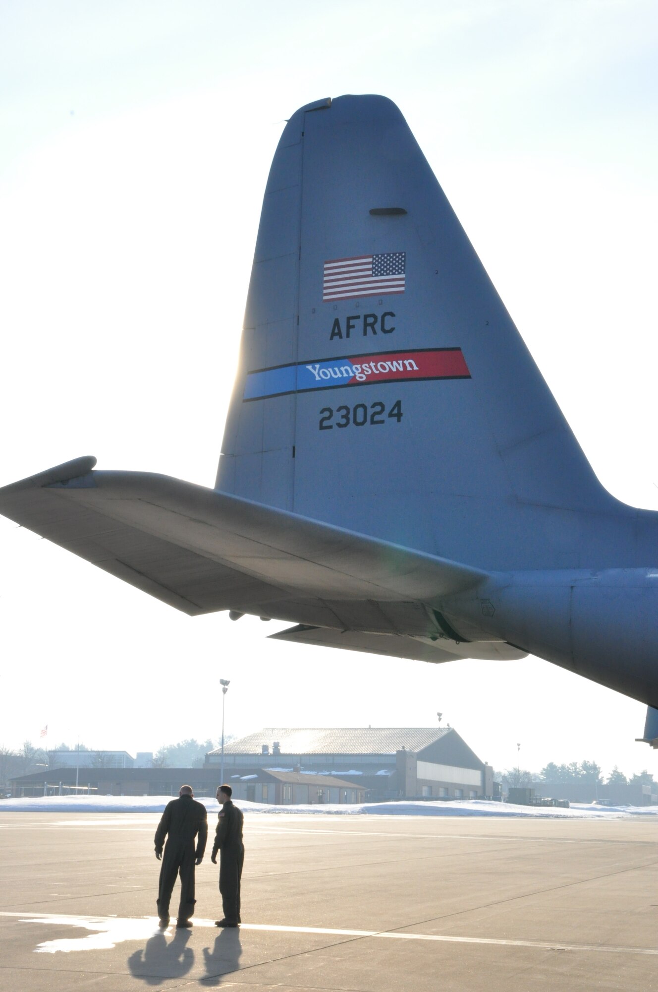 YOUNGSTOWN AIR RESERVE STATION, Ohio – Air Force Reserve Loadmasters Senior Airman Tim Kantorak and Senior Aiman James Hudson, both assigned to the 757th Airlift Squadron, discuss mission details, while standing beneath the tail of a 910th Airlift Wing C-130H Hercules aircraft on the flightline here prior to an airdrop training mission, March 8, 2015. Loadmasters are responsible for the personnel and materials aboard the aircraft prior to delivery by airdrop or air-land methods. With specialized training, the 910th’s loadmaster can be certified as system operators for the wing’s mission as the Department of Defense’s only large-area fixed-wing aerial spray capability. U.S. Air Force photo by Master Sgt. Bob Barko Jr.