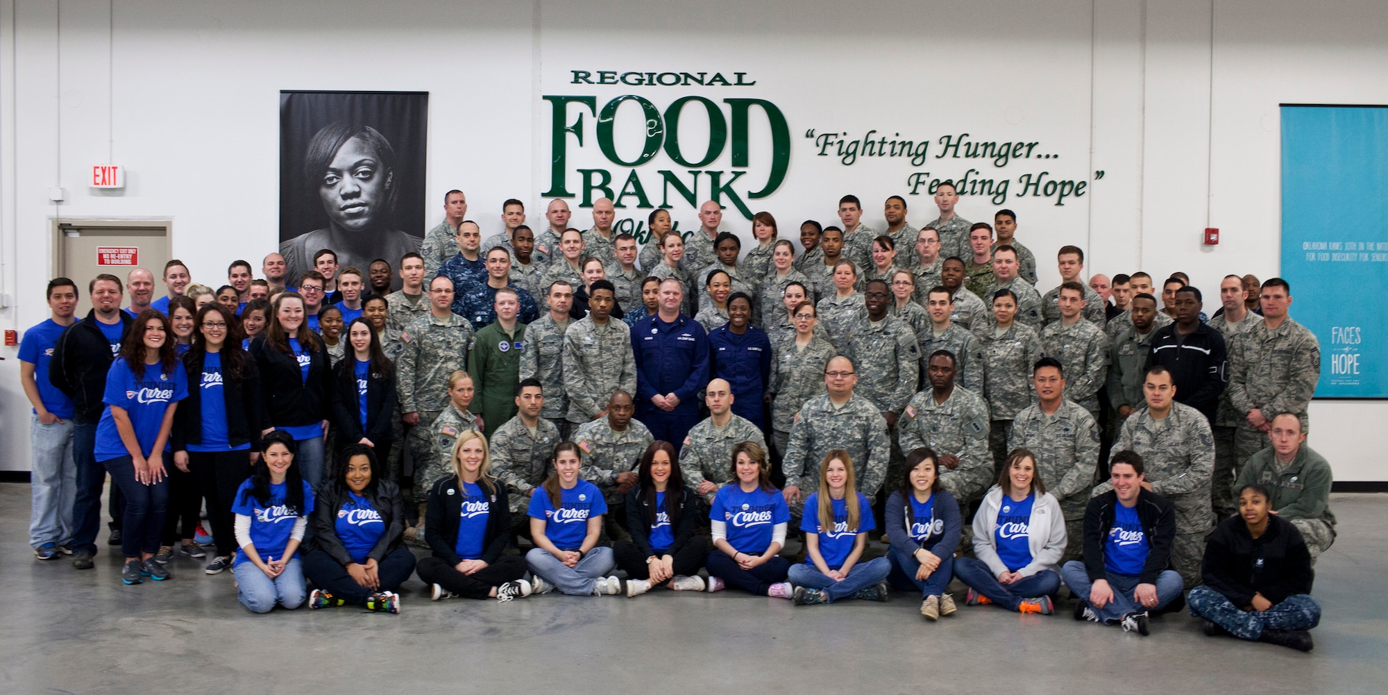 Staff members with the Oklahoma City Thunder and servicemembers from across Oklahoma pose for a photo during a joint NBA and Department of Defense volunteer event at the Regional Food Bank of Oklahoma on Monday. (Photo courtesy of Regional Food Bank of Oklahoma)