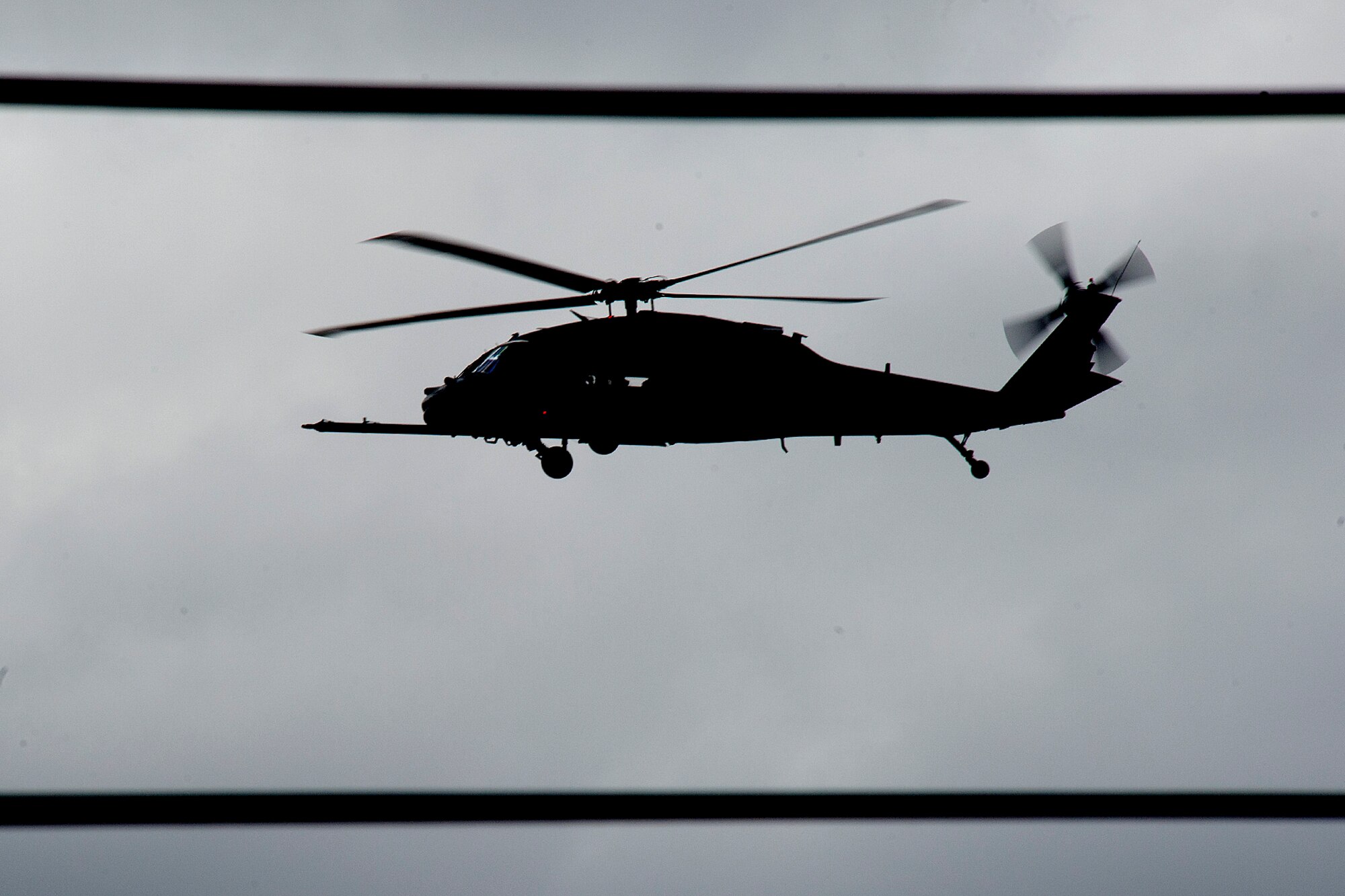 A 48th Fighter Wing HH-60G Pave Hawk flies off after a simulated rescue during close air support training in the hilly terrain of Hinderclay, England, March 5, 2015. The training included Tornado GR-4 pilots, Royal Air Force Regiment personnel and U.S. Air Force HH-60G aircrew. They worked together to suppress simulated enemies and make a successful recovery. (U.S. Air Force photo by Airman 1st Class Trevor T. McBride/Released)