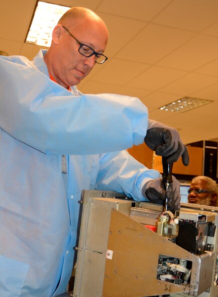 Ernest Greer, 566th Electronics Maintenance Squadron electronics mechanic, showcases an unclassified digital display indicator. (U.S. Air Force photo by Ed Aspera)
