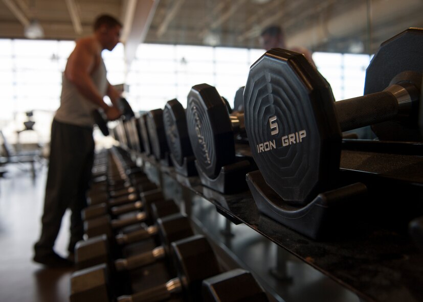 Free weights sit in their respective racks Jan. 30, 2015, at the Fitness Center on Dover Air Force Base, Del. The Fitness Center will begin operating on a 24-hour, seven days per week schedule in mid-March. (U.S. Air Force photo/Airman 1st Class Zachary Cacicia)