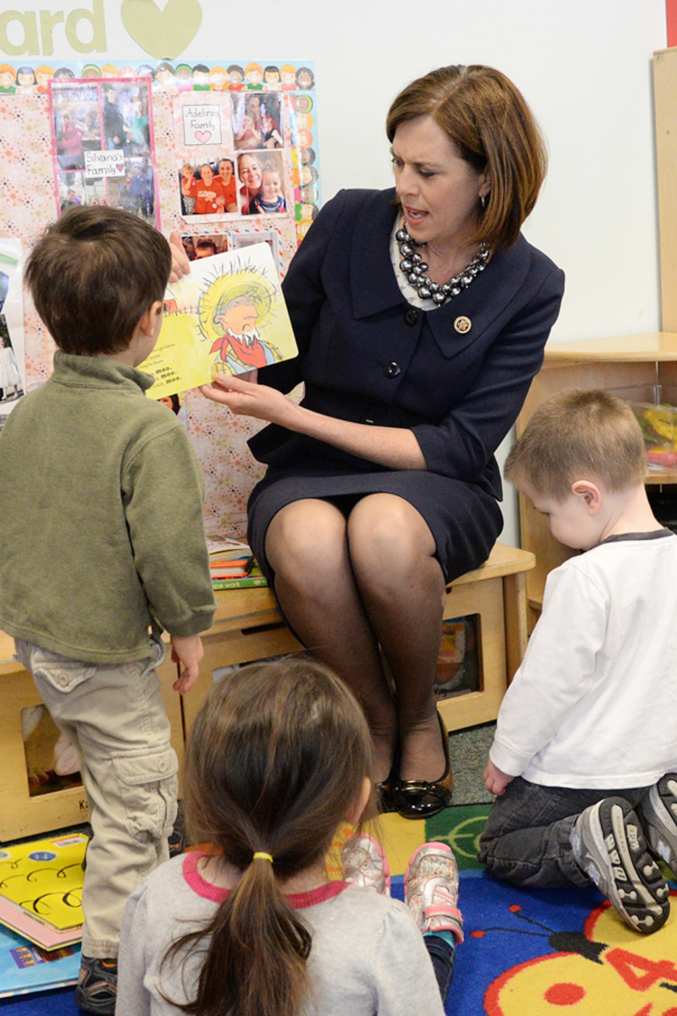 U.S. Rep. Katherine Clark reads to children during a visit to the Child Development Center here, March 12. Clark also met with the CDC staff to discuss military child care and related topics during her visit and read to several groups of children. (U.S. Air Force photo by Linda LaBonte Britt)  

