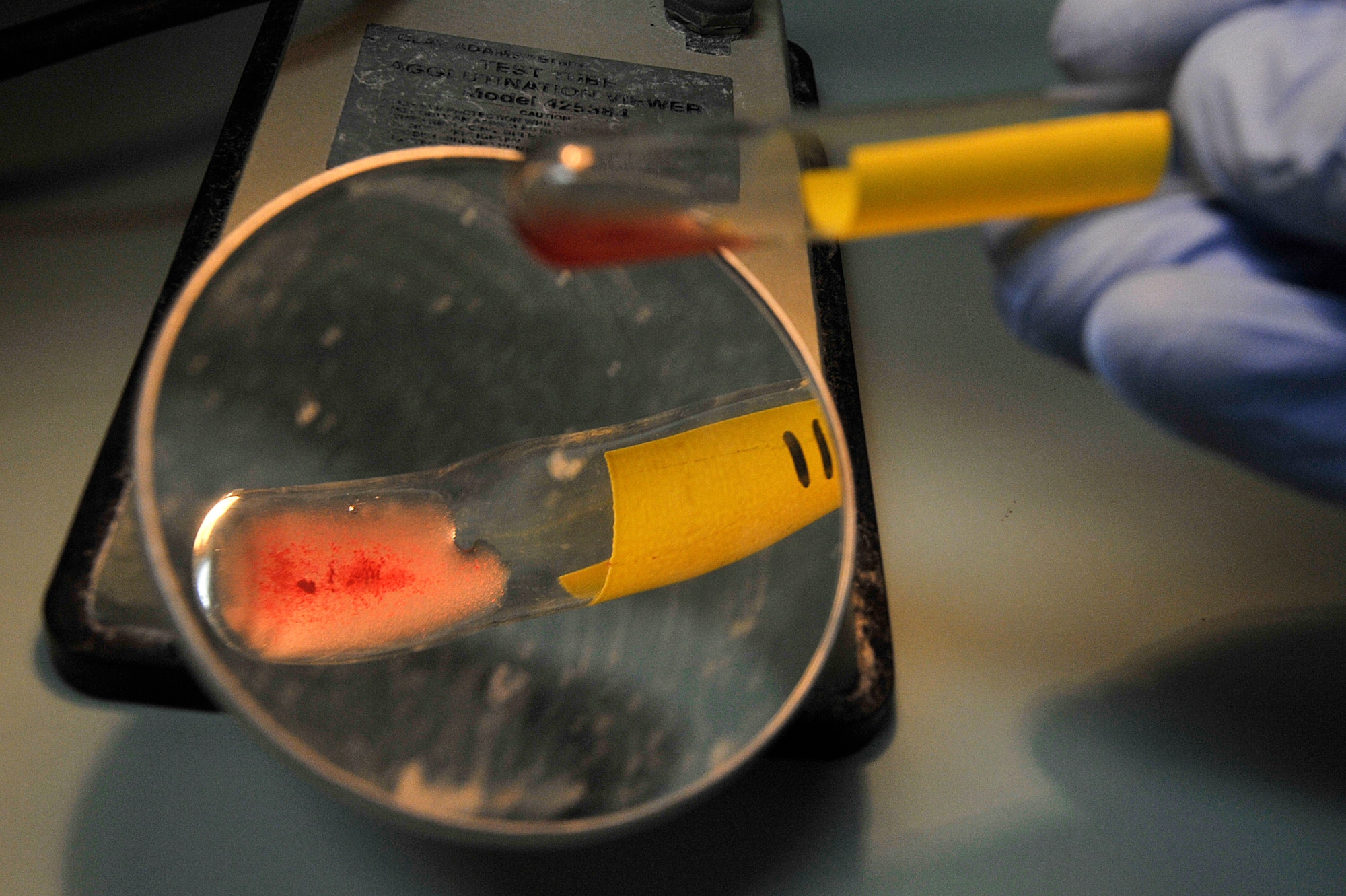 U.S. Air Force Senior Airman Rion Urven, 35th Medical Support Squadron medical lab technician, conducts an antibody screening at Misawa Air Base, Japan, March 11, 2015. Utilizing a centrifuge, used to separate bloods cells from plasma cells, lab technicians must look for and identify any unusual or unexpected antibodies. (U.S. Air Force photo by Senior Airman Jose L. Hernandez-Domitilo/Released)