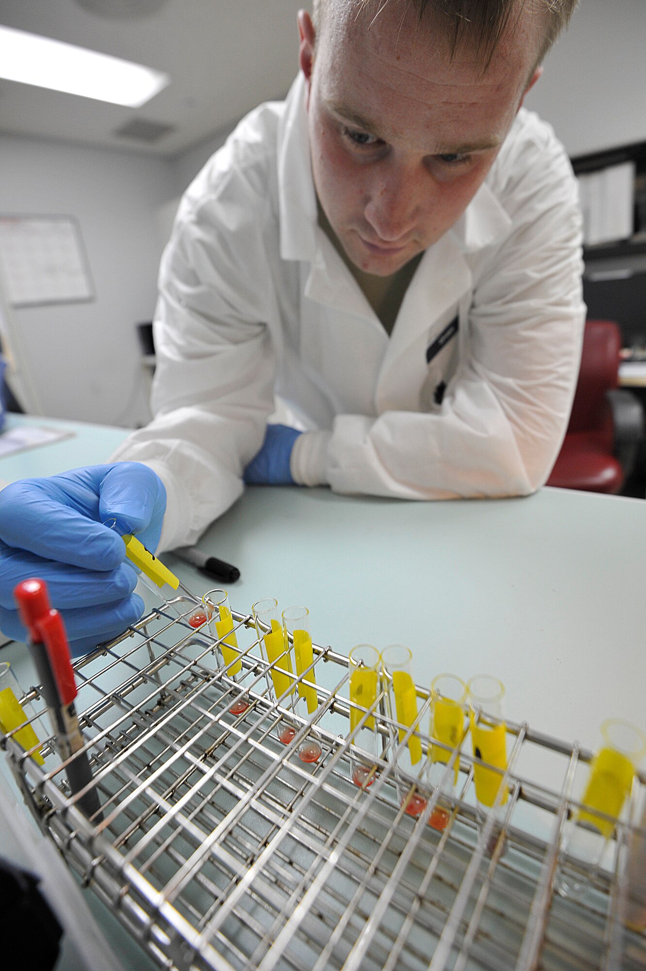 U.S. Air Force Senior Airman Rion Urven, 35th Medical Support Squadron medical lab technician, conducts an antibody screening test at the blood bank at Misawa Air Base, Japan, March 11, 2015. When completing an antibody screening test, lab technicians must look for and identify any unusual or unexpected antibodies in the blood cells. (U.S. Air Force photo by Senior Airman Jose L. Hernandez-Domitilo/Released)