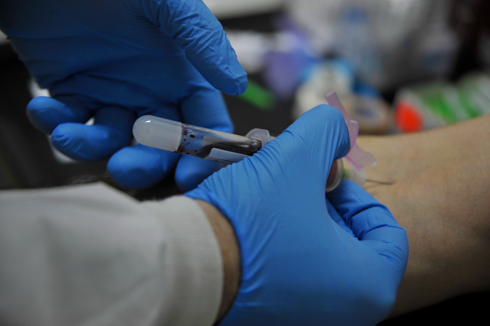 U.S. Air Force Staff Sgt. Christopher Bedics, 35th Medical Support Squadron NCO in charge of hematology and coagulation, draws blood from a patient at Misawa Air Base, Japan, March 11, 2015. Whether it is for a medical diagnostic or annual check-up, lab technicians provide doctors with accurate information to assist in the diagnosis and treatment of patients. (U.S. Air Force photo by Senior Airman Jose L. Hernandez-Domitilo/Released)