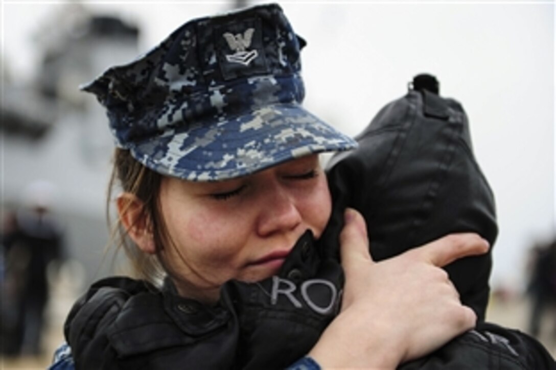 Navy Petty Officer 2nd Class Ashley Urias says farewell to her family before embarking on the guided-missile destroyer USS Winston S. Churchill for deployment in Naval Station Norfolk, Va., March 9, 2015. Churchill, part of the Theodore Roosevelt Carrier Strike Group, will conduct operations in the U.S. 5th, 6th, and 7th Fleet areas of responsibility. 
