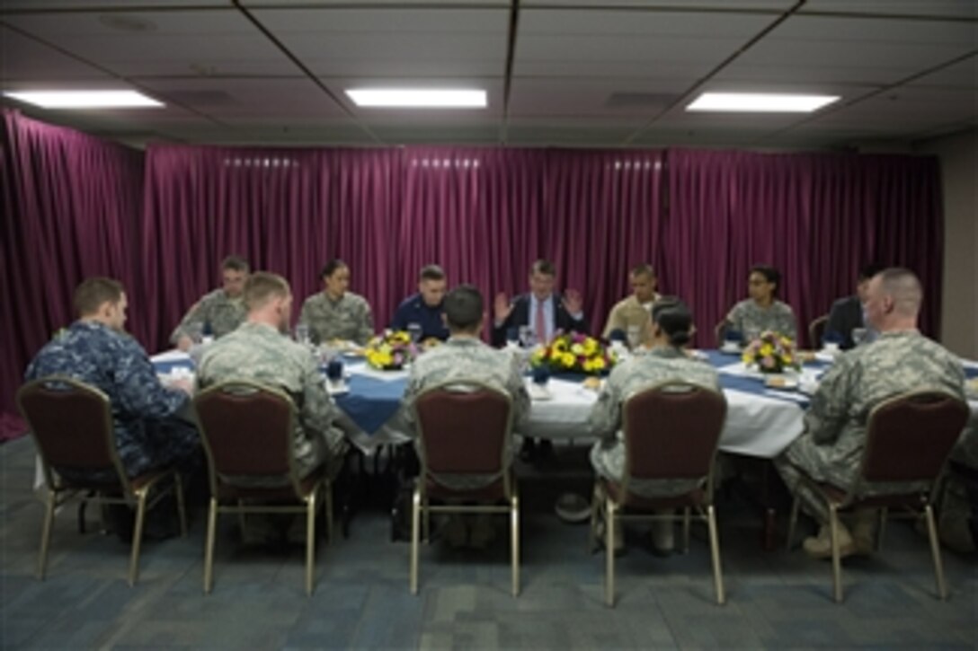 Defense Secretary Ash Carter has lunch with service members during a visit to U.S. Cyber Command on Fort Meade, Md., March 13, 2015.