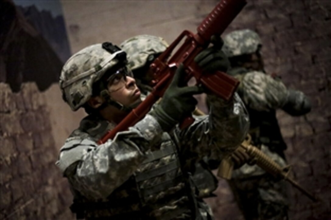Soldiers participate in a modern army combatives program training scenario on Joint Base McGuire-Dix-Lakehurst, N.J., March 11, 2015.
