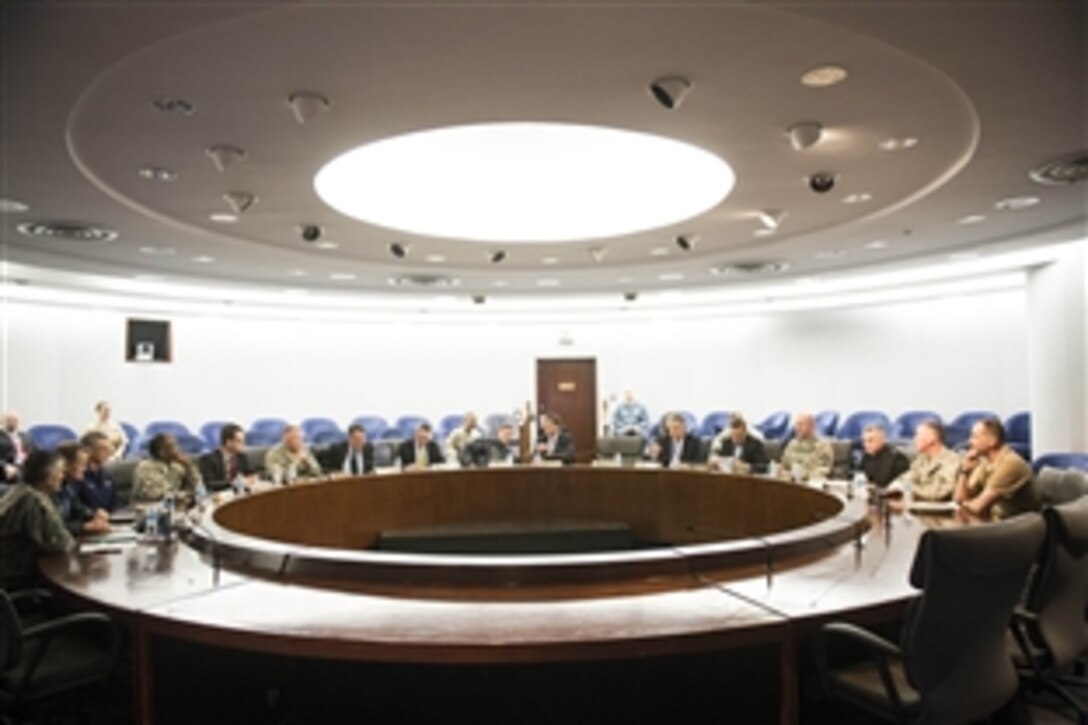 Defense Secretary Ash Carter meets with Navy Adm. Mike S. Rogers and senior staff members during a visit to U.S. Cyber Command on Fort Meade, Md., March 13, 2015. Carter also toured the facility and hosted a town hall with service members, his first as secretary.