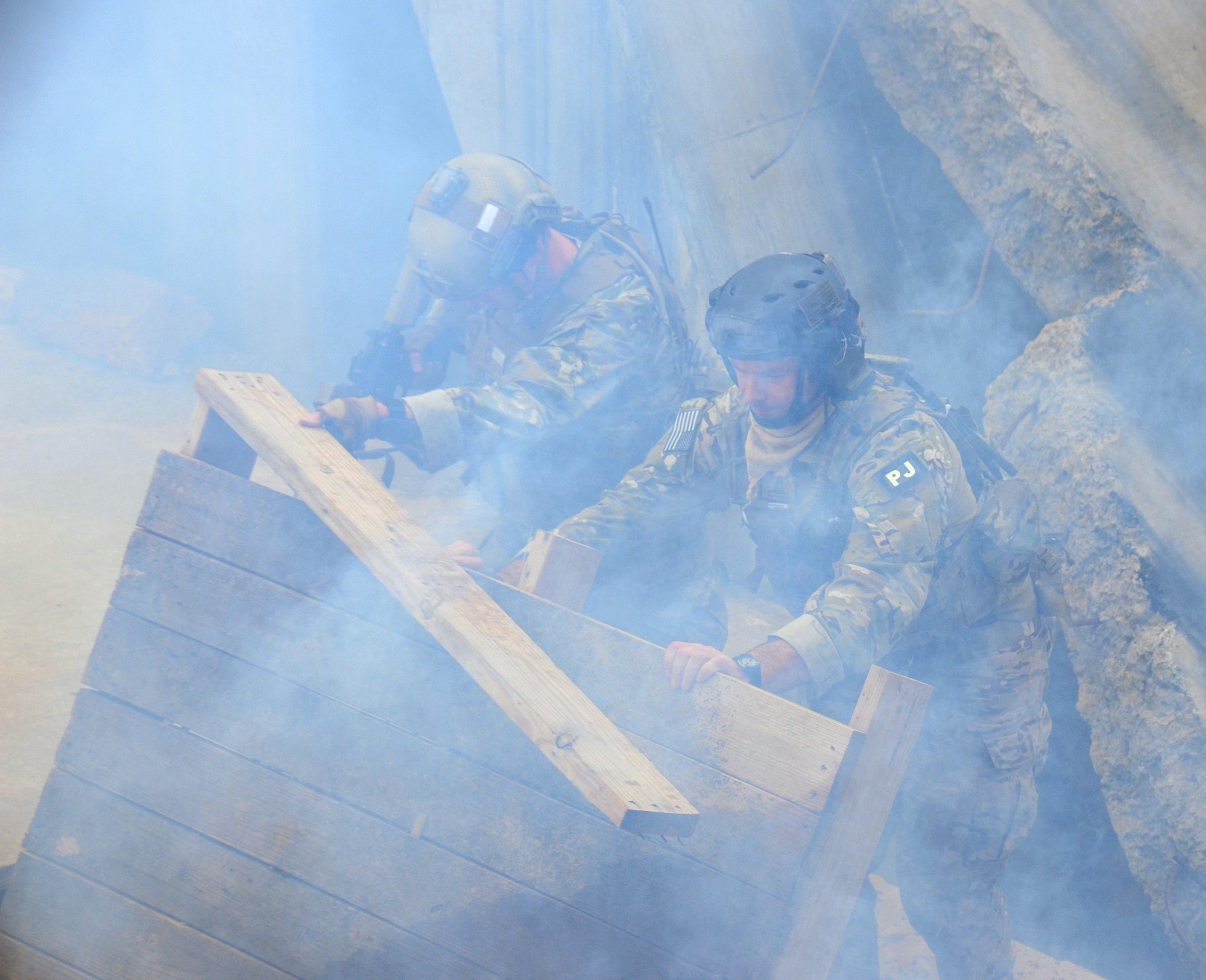 Pararescue Jumpers and Combat Rescue Officers, 920th Rescue Wing, Patrick AFB, FL, conduct search and rescue response training at the Guardian Center training facility March 8, 2015 in Perry, GA. This four-day exercise used HH-60 Pave Hawks and MV-22 Ospreys for simulated scenarios that included earthquake collapsed buildings, vehicle-borne improved explosive devices detonating, and mass casualty response. (U.S. Air Force photo/Staff Sgt. Kelly Goonan)