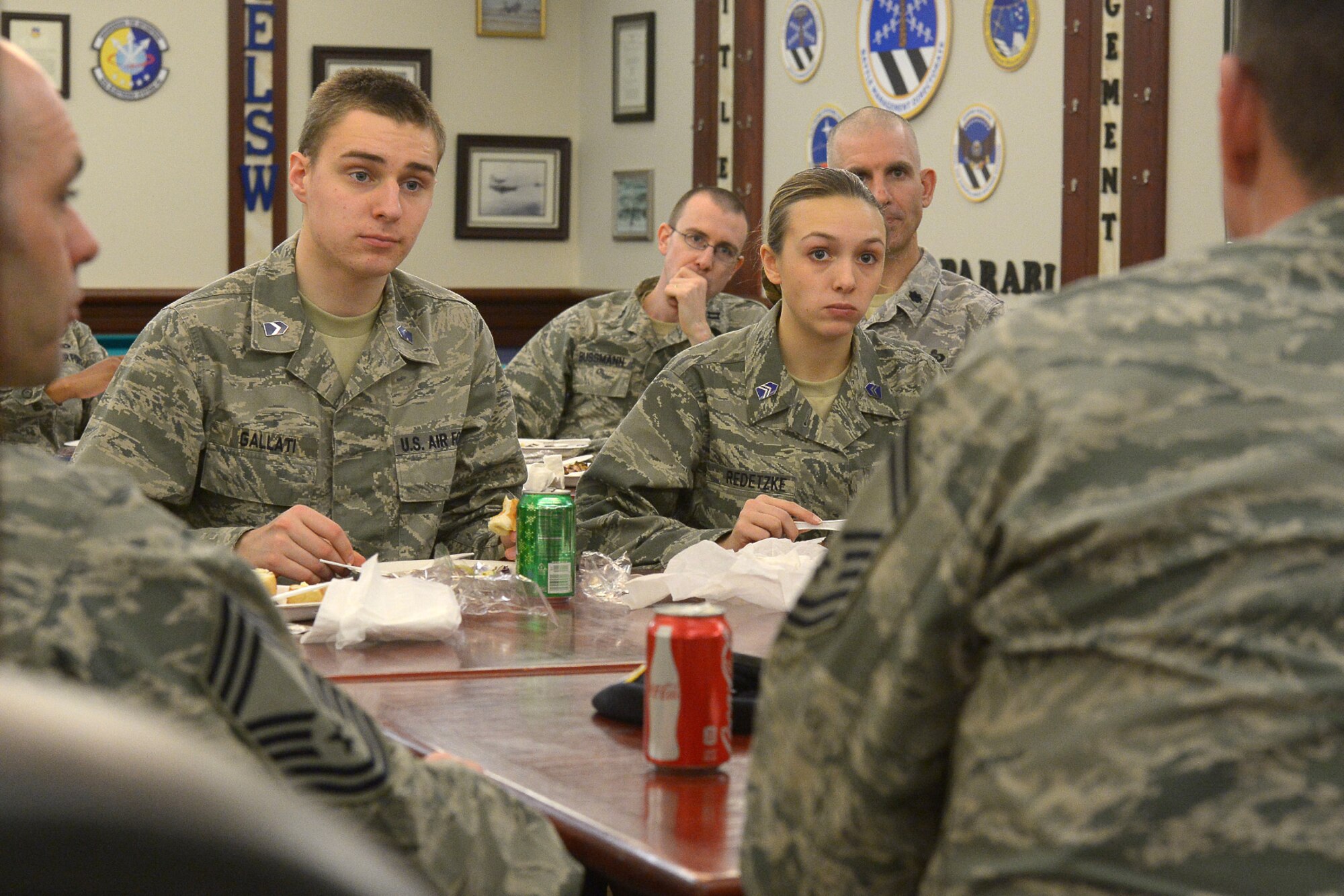 Cadets Walter Gallati and Savannah Redetzke from Worcester Polytechnic Institute Detachment 340Air Force Reserve Officers Training Corps listen as Hanscom Senior NCOs offer advice over lunch during a mentoring session at the Minuteman Commons March 10. The cadets spoke with the enlisted leaders to seek advice on successful ways a new officer can effectively lead enlisted Airmen, especially those Airmen with years of experience behind them. (U.S. Air Force photo by Jerry Saslav)