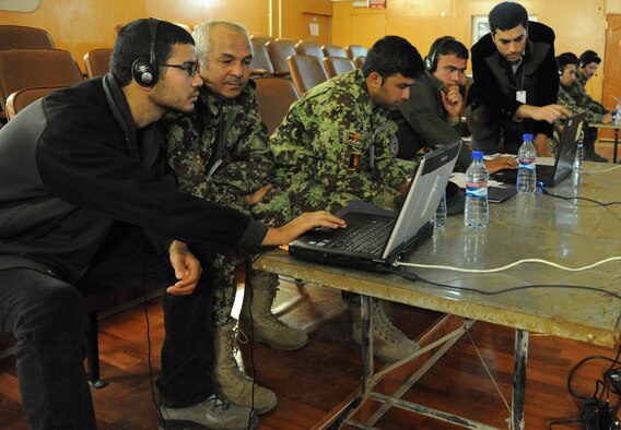 Airmen from the Afghan Air Force go through the hands-portion of training during a web conferencing class. Train, Advise, Assist Command-Air advisor are teaching the class so they have a farther advising reach. (U.S. Air Force photo by Senior Master Sgt. J. LaVoie/Released)
