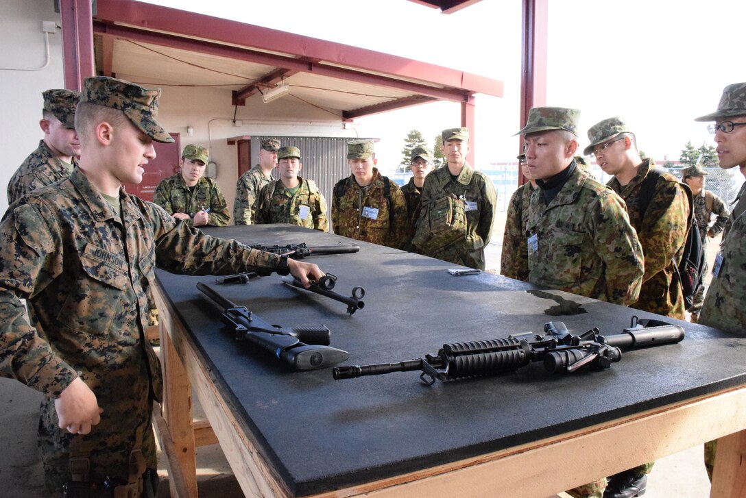 4 Mar 2015, Camp Fuji, Gotemba Japan (Photo by G5 Junko Akabane, Bilateral Engagement Coordinator, Co-Op Visit #75, JGSDF) - Students in the Bilateral Engagement Program of the US Army Japan visiting CATC Camp Fuji received a familiarization brief on weapons from the CATC Camp Fuji Armor, as well as briefs about Marine Corps tactical vehicles and equipment.  The Co-Op Group visits Camp Fuji 4 times a year to conduct language interaction training and enhance interoperability and overall inter-service awareness.