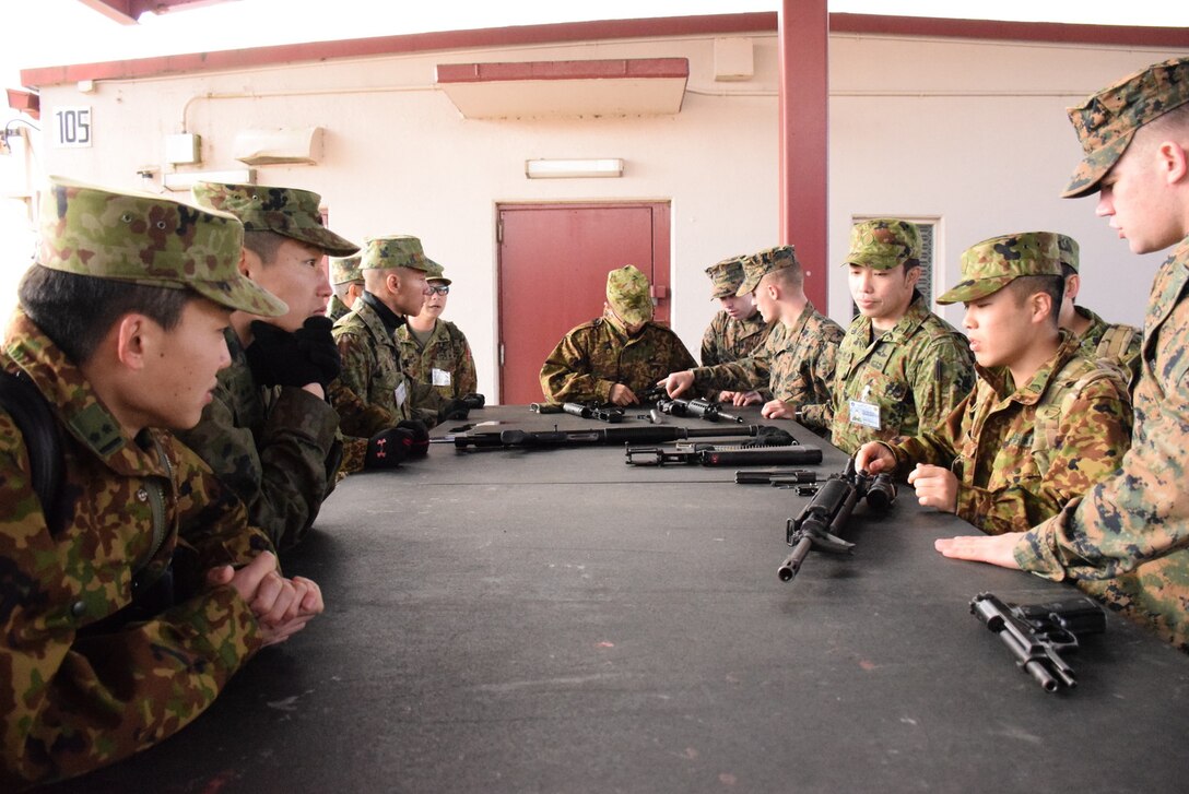 4 Mar 2015, Camp Fuji, Gotemba Japan (Photo by G5 Junko Akabane, Bilateral Engagement Coordinator, Co-Op Visit #75, JGSDF) - Students in the Bilateral Engagement Program of the US Army Japan visiting CATC Camp Fuji received a familiarization brief on weapons from the CATC Camp Fuji Armor, as well as briefs about Marine Corps tactical vehicles and equipment.  The Co-Op Group visits Camp Fuji 4 times a year to conduct language interaction training and enhance interoperability and overall inter-service awareness.