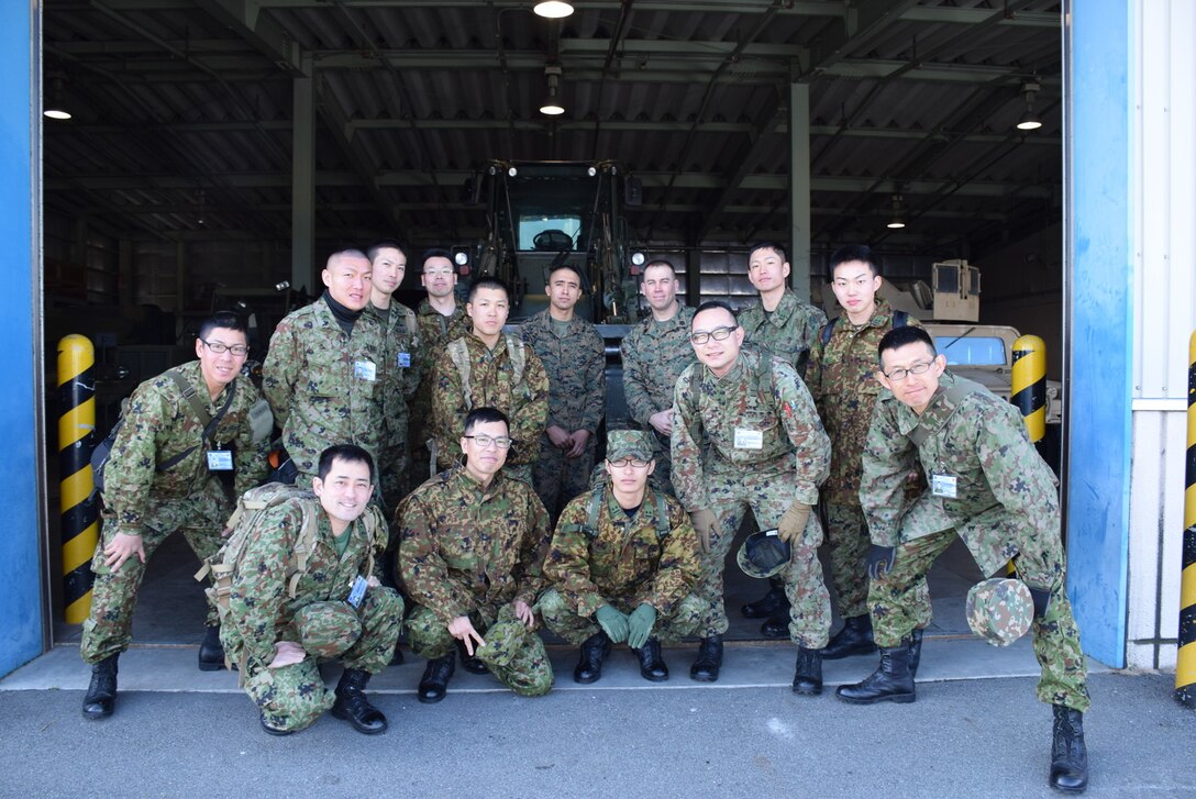 4 Mar 2015, Camp Fuji, Gotemba Japan (Photo by G5 Junko Akabane, Bilateral Engagement Coordinator, Co-Op Visit #75, JGSDF) - Students in the Bilateral Engagement Program of the US Army Japan visiting CATC Camp Fuji received a familiarization brief on weapons from the CATC Camp Fuji Armor, as well as briefs about Marine Corps tactical vehicles and equipment.  The Co-Op Group visits Camp Fuji 4 times a year to conduct language interaction training and enhance interoperability and overall inter-service awareness.