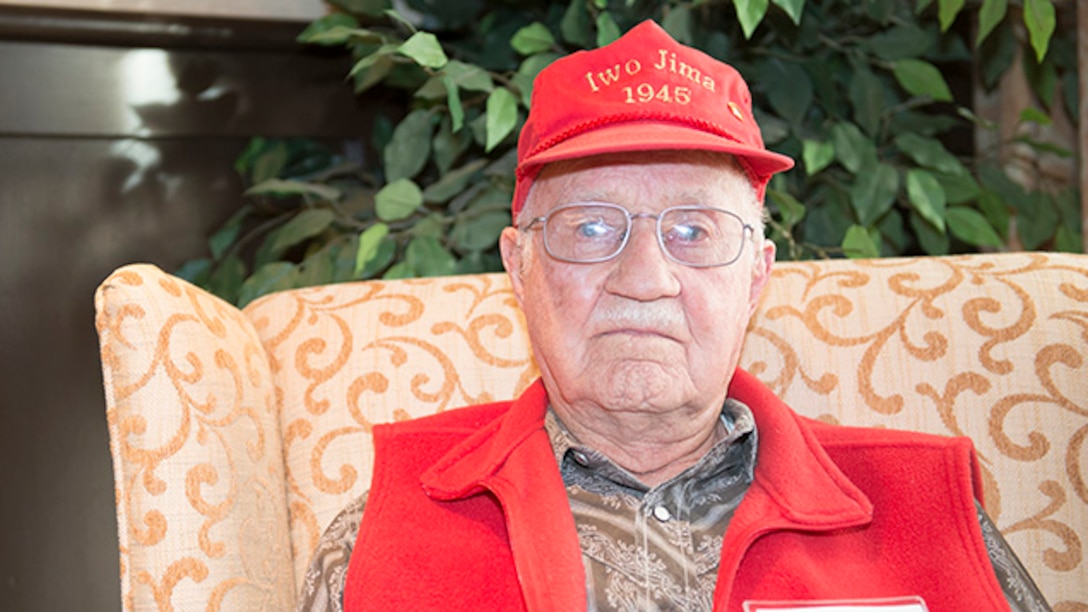 Raymond Lueb, Marine survivor from the battle of Iwo Jima, poses for a photo during the Iwo Jima Battle Survivors and Family Association 70th anniversary reunion at Wichita Falls, Texas, February 14, 2015. Lueb served in the Marine Corps from January 1944 until May 1946.