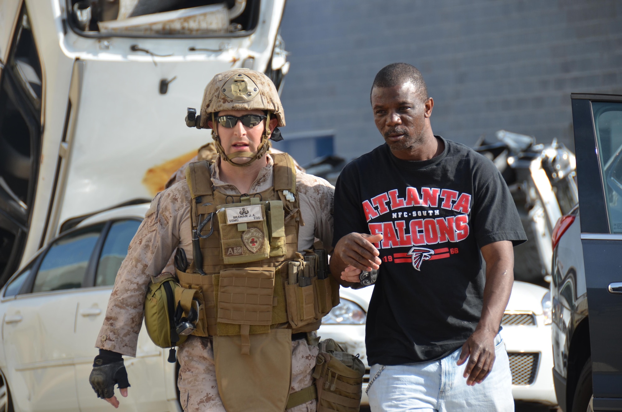 Pararescue Jumpers and Combat Rescue Officers, 920th Rescue Wing, Patrick AFB, FL, conduct joint training with a Marine Osprey tilt-rotor aircraft at the Guardian Center training facility March, 2015 in Perry, GA. This four-day exercise used HH-60 Pave Hawks and MV-22 Ospreys for simulated scenarios that included earthquake collapsed buildings, vehicle-borne improved explosive devices detonating, and mass casualty response. (U.S. Air Force photo illustration/Staff Sgt. Kelly Goonan)