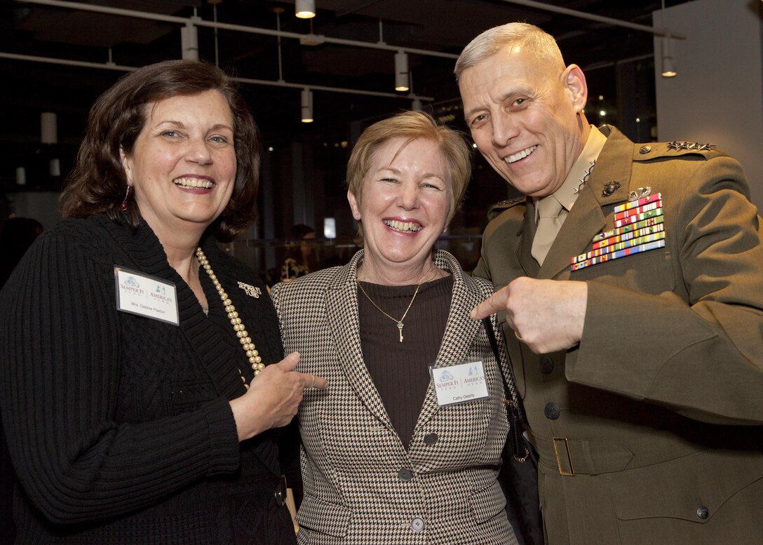 The Assistant Commandant of the U.S. Marine Corps, Gen. John M. Paxton, Jr., poses for a photo during the reception for the Semper Fi Fund and America’s Fund in Manhattan, N.Y., March 12, 2015. The Semper Fi Fund was established in 2004 and has since then provided assistance to over 13,500 veterans and their families. (U.S. Marine Corps photo by Cpl. Tia Dufour/Released)