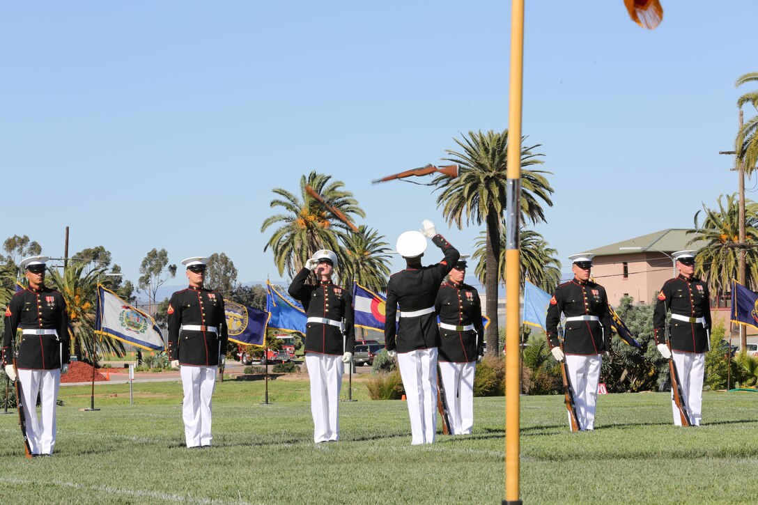 Marines with the Silent Drill Platoon throw their rifles during a Battle Colors Ceremony aboard Marine Corps Air Station Miramar, Calif., March 13. The Battle Colors Ceremony consists of a performance by the Silent Drill Platoon and “the Commandant’s Own” Drum and Bugle Corps.