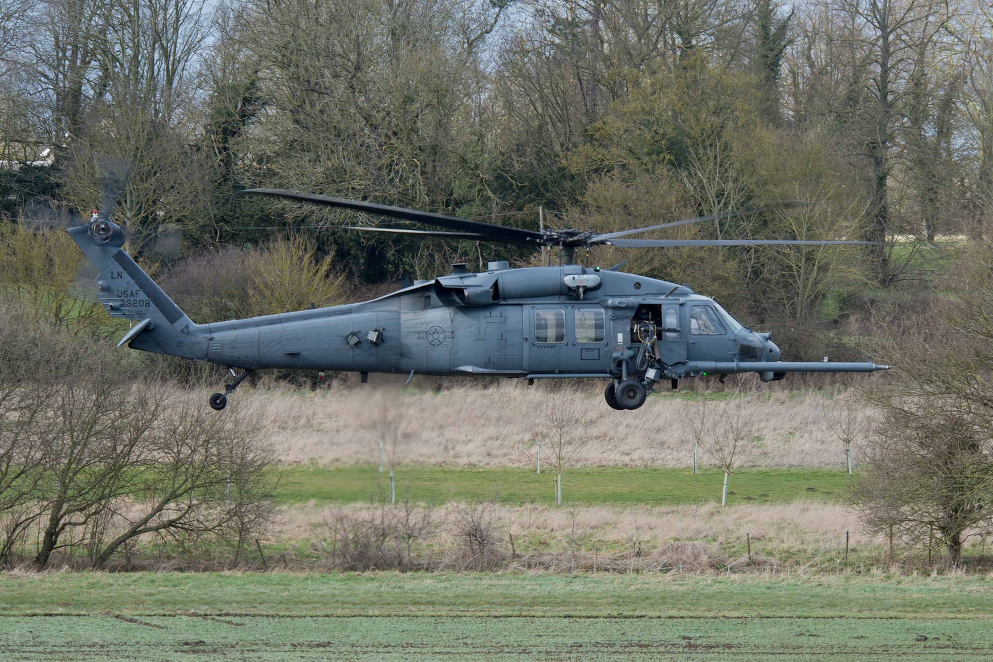 A 48th Fighter Wing HH-60G Pave Hawk clears an area during combat search and rescue training March 5, 2015, in the hilly terrain of Hinderclay, England. The training included Tornado GR4 pilots, Royal air force Regiment personnel and U.S. Air Force HH-60G aircrew. They worked together to suppress simulated enemies and make a successful recovery. (U.S. Air Force photo/Airman 1st Class Trevor T. McBride)