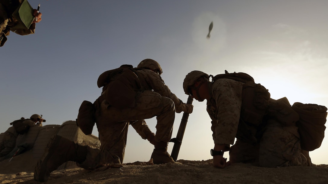 Mortarmen with Kilo Company, Battalion Landing Team 3rd Battalion, 6th Marine Regiment, 24th Marine Expeditionary Unit, fire a round from an M224 60 mm mortar at a live-fire range ashore in the U.S. 5th Fleet area of operations, Feb. 11, 2015. The 24th MEU is conducting theater security cooperation exercises to increase cooperation and interoperability, enhance relationships with existing partners, and promote long-term regional stability within the U.S. 5th Fleet area of operations. The 24th MEU is embarked on the ships of the Iwo Jima Amphibious Ready Group and deployed to maintain regional security in the U.S. 5th Fleet area of operations. 