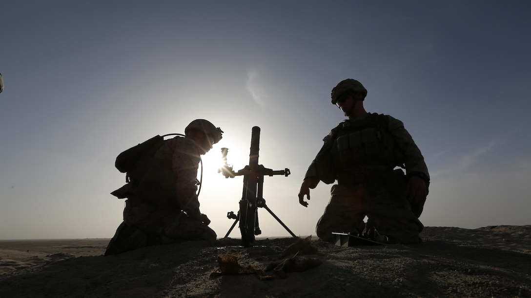 Mortarmen with Kilo Company, Battalion Landing Team 3rd Battalion, 6th Marine Regiment, 24th Marine Expeditionary Unit, set up an M224 60 mm mortar at a live-fire range ashore in the U.S. 5th Fleet area of operations, Feb. 11, 2015. The 24th MEU is conducting theater security cooperation exercises to increase cooperation and interoperability, enhance relationships with existing partners, and promote long-term regional stability within the U.S. 5th Fleet area of operations. The 24th MEU is embarked on the ships of the Iwo Jima Amphibious Ready Group and deployed to maintain regional security in the U.S. 5th Fleet area of operations.