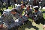 Soldiers from the Oklahoma National Guard learn how to evacuate a casualty onto a Sked Litter during a four-day Combat Lifesaver course held at Camp Rapid June 18, 2010. The Combat Lifesaver course was given by the Army Reserve’s 399th Combat Support Hospital, based out of Bedford, Mass., as part of South Dakota’s 26th annual Golden Coyote training exercise.