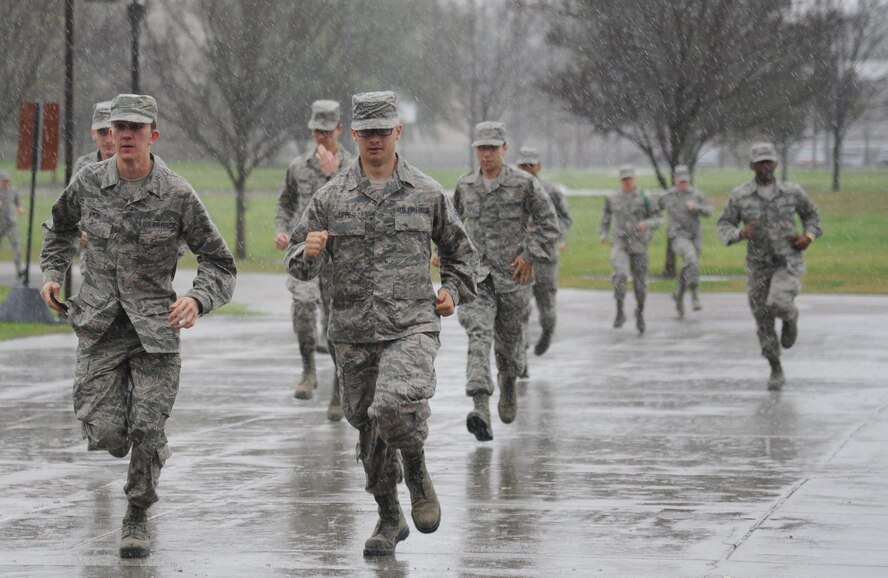 Airmen in the 335th Training Squadron run from Davis Manor to Connor Manor while transitioning between training stations during an “Introduction to Mobility” training day for non-prior service Airmen at Keesler Air Force Base, Mississippi, March 13, 2015. Airmen participated in pre-deployment training scenarios such as: going through a mobility processing line, administering self-aid and buddy care, reviewing the steps for chemical warfare gear and receiving a pre-deployment briefing. The training was conducted to better prepare Keesler’s Airmen for deployment operations. (U.S. Air Force photo by Kemberly Groue)