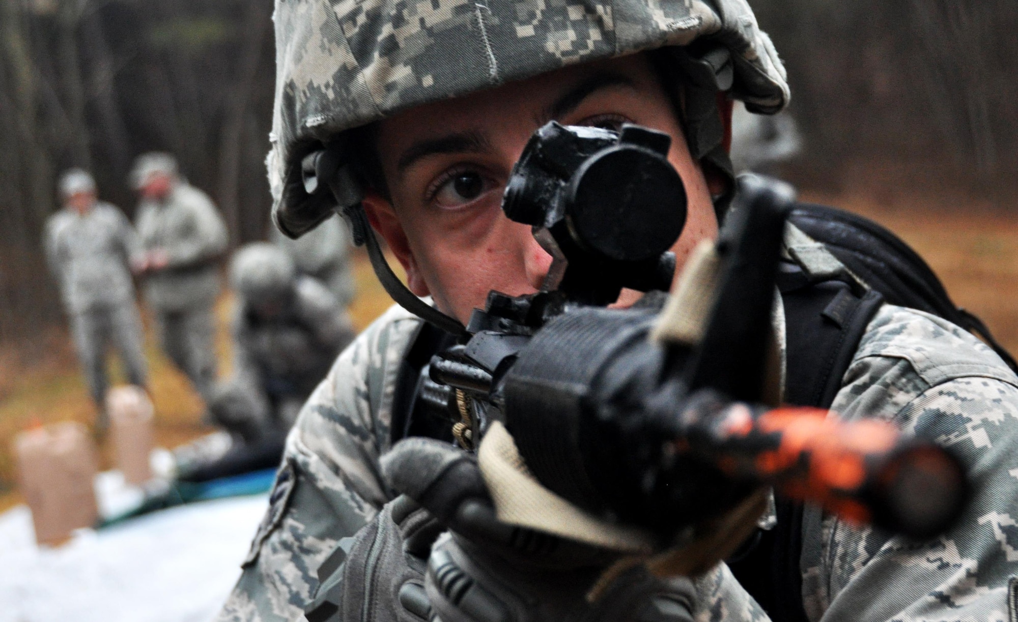 Senior Airman Tyler Wright, 911th Force Support Squadron from Pittsburgh, Pa., guards his team as they care for casualties during a simulated attack during a Silver Flag exercise March 10, 2015, at Dobbins Air Reserve Base, Ga. Services Airmen from six different installations across Air Force Reserve Command participated in the Silver Flag training exercises at Dobbins.  (U.S. Air Force photo/Senior Airman Daniel Phelps/Released)